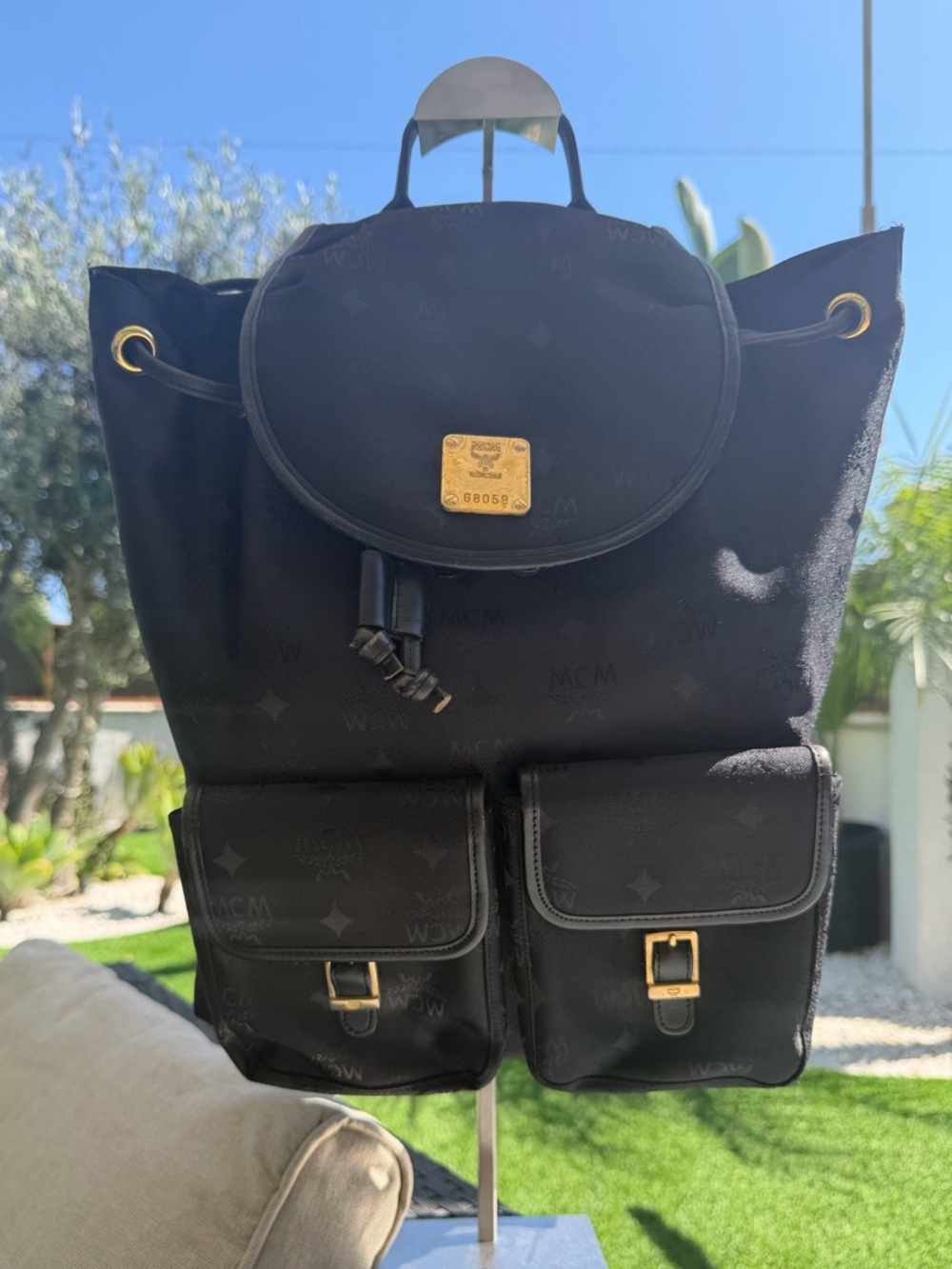 MCM Black Visetos Drawstring Backpack with Gold Accents